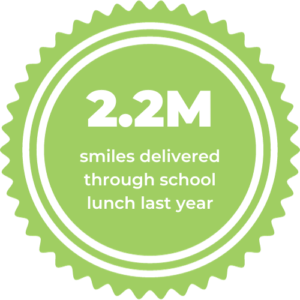 Seal image with quote that My Hot Lunch Box delivered 2.2M lunches to schools last year